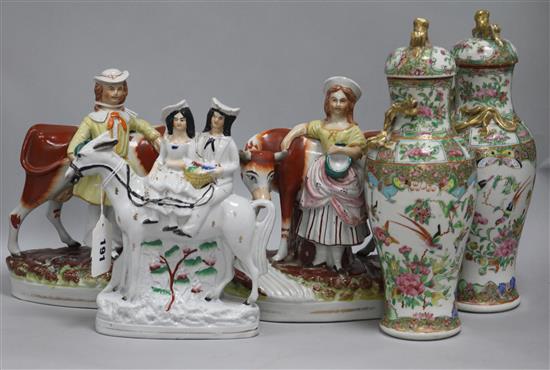 A pair of Staffordshire groups, cowhand and milkmaid with cows, a Parson and Nightwatchman group and three other figures